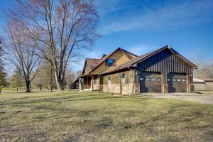 a large house with a gambrel roof at Central Michigan Vacation Rental Near Frankenmuth! in Birch Run
