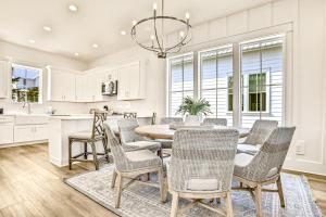 a kitchen and dining room with a table and chairs at Between the Lake and the Ocean in Santa Rosa Beach