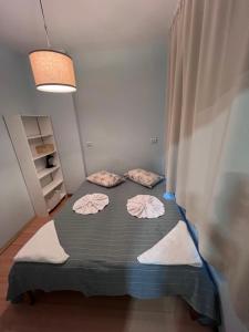 A bed or beds in a room at Apartment Saborni