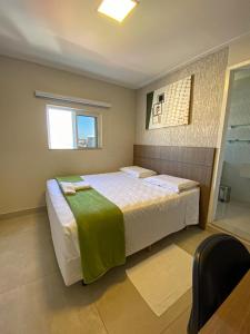 Postel nebo postele na pokoji v ubytování Hotel Imperatriz