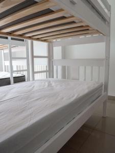 a white bunk bed in a white room at Mestre Tornabell 11 in Bas