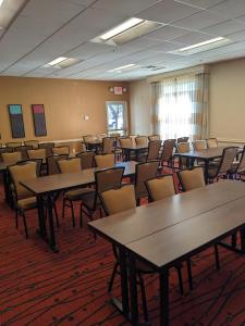 an empty classroom with tables and chairs in it at Sonesta ES Suites Birmingham Homewood in Birmingham