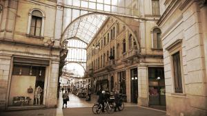 a group of people riding bikes in a shopping mall at Residenze Venezia Apartments in Mestre