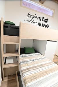 a bunk bed with a sign that reads be like im mickey we all at L'Antico Camino - Alloggio Turistico in Acquapendente