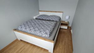 a small bed in a small room with at Cztery kąty in Bielsko-Biała