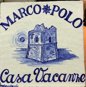 a cake with a drawing of a building on it at Marco Polo Casa Vacanze in Pollina