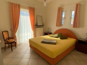 a bedroom with a bed with a keyboard on it at Country house Nafpaktos in Nafpaktos