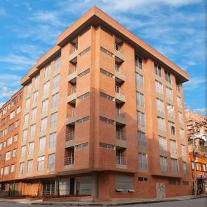 a large brick building on the side of a street at ICON 48 Luxury Apartasuites in Bogotá