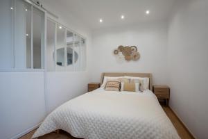 Llit o llits en una habitació de Appartement T2 les pieds dans l'eau à Argeles-Sur-Mer