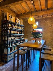 a room with a table and some bottles of wine at punti di vista in Bibbona