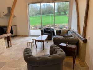 Część wypoczynkowa w obiekcie Gîte, Maison entière avec billard et bel espace de vie La Grange