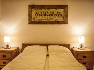 a bedroom with a bed and two night stands with lamps at Appartement Tignes, 4 pièces, 6 personnes - FR-1-480-2 in Tignes