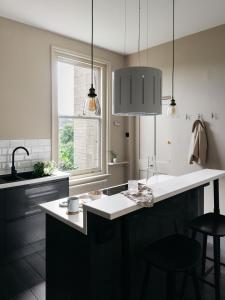 a kitchen with a sink and a window at The Curator's Apartment - 2 Bedrooms with parking in Bath