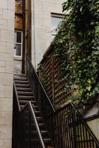 a set of stairs leading up to a building at The Curator's Apartment - 2 Bedrooms with parking in Bath