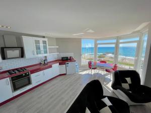 a kitchen with a person laying on the floor at SA Apartments! Sea View 2bd Flat in Alanya