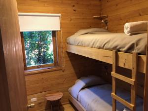 Palanda nebo palandy na pokoji v ubytování Cabañas Borgolafquen