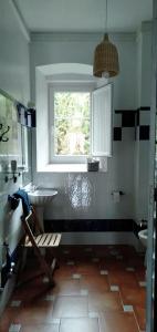 a bathroom with a sink and a window at CASA DE INDIANoS, UNA EXPERIENCIA UNICA EN EL CENTRO DE CANTABRIA in San Vicente de Toranzo +29 photos