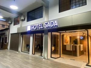 a hotel saale sign on the front of a building at Hotel Sada in Guayaquil