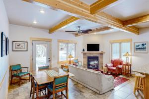a living room with a couch and a table at Wallowa Lake Wonder in Joseph