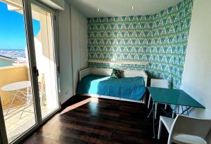 Postel nebo postele na pokoji v ubytování Residence Frontemare