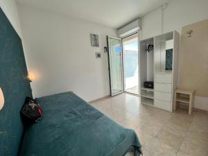Postel nebo postele na pokoji v ubytování Residence Frontemare
