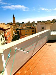 a view of a city from the roof of a building at APARTAMENTOS ELEMAR free luggage storage in Málaga