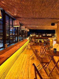 a bowling alley with tables and chairs in a restaurant at Casa Sabina Down Town Mexico City in Mexico City