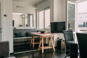 a living room with a table and a couch at Smart hostel in Belgrade