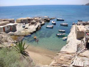 a group of boats in a body of water at Tardin in Nador
