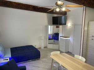 a bedroom with a bed and a dining room table at Le Civette in Ferrara