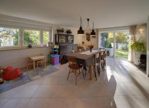 a kitchen and dining room with a table and chairs at Widokówka Karkonoska in Szklarska Poręba