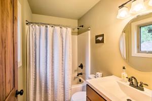 a bathroom with a sink and a shower curtain at Mountain View Boone Home Close to Blue Ridge Pkwy! in Blowing Rock +36 photos