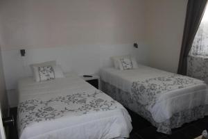 Uma cama ou camas num quarto em Moradia Familiar NovaVista - T3