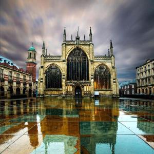 a large building with water in front of it at Hullidays》Marina Town House in Hull