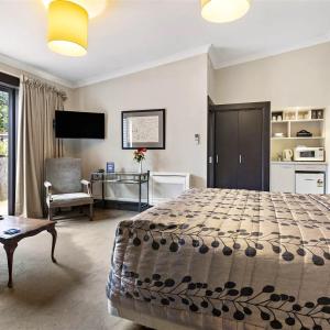 Voodi või voodid majutusasutuse Gateway Motor Inn toas