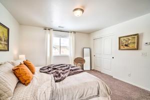 a bedroom with a bed and a window at Family-Friendly Home about 12 Mi to Downtown Flagstaff in Bellemont