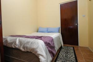 Una cama o camas en una habitación de La Vue 2