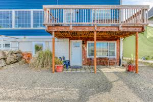 a house with a deck on top of it at Cake by the Ocean in Lincoln City