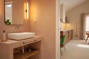 a bathroom with a sink and a mirror at Vila Rodrigues in Lisbon +158 photos