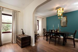 a dining room with a table and chairs at Westwood Cottage in Longniddry