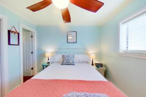 a bedroom with a bed with a ceiling fan at Hilton Head Resort 2221 in Hilton Head Island +24 photos