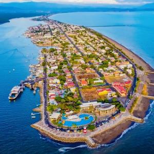 an island in the ocean with a resort at CasaLu in Puntarenas