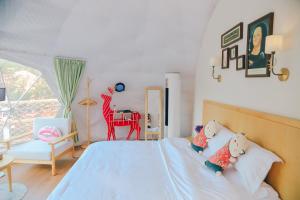 Ένα ή περισσότερα κρεβάτια σε δωμάτιο στο Starstay Wuling Mountain B&B