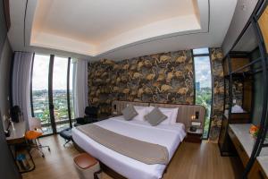 Sayarsan Hotel Yangon客房内的一张或多张床位