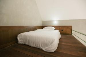 Ein Bett oder Betten in einem Zimmer der Unterkunft LAYANA FARMSTAY