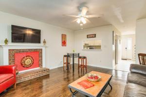 a living room with a couch and a fireplace at Bayside Manor near Airport & Beaches in Pensacola