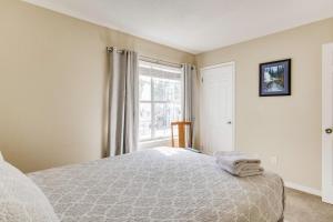 a bedroom with a bed and a window at Bayside Manor near Airport & Beaches in Pensacola