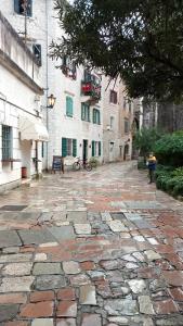 a cobblestone street in front of a building at Apartments Đukić in Kotor
