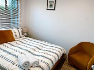 Giường trong phòng chung tại Sea Breeze 3 bedroom Apartment Mount Maunganui