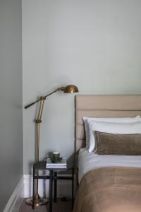 מיטה או מיטות בחדר ב-Mittagong Hotel